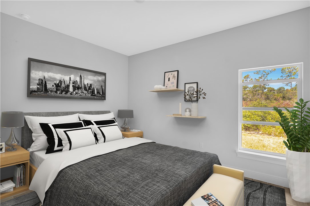 3395 3rd Place Vero Beach, FL 32968 - Photo 7 of 15 a bedroom with a bed and a window