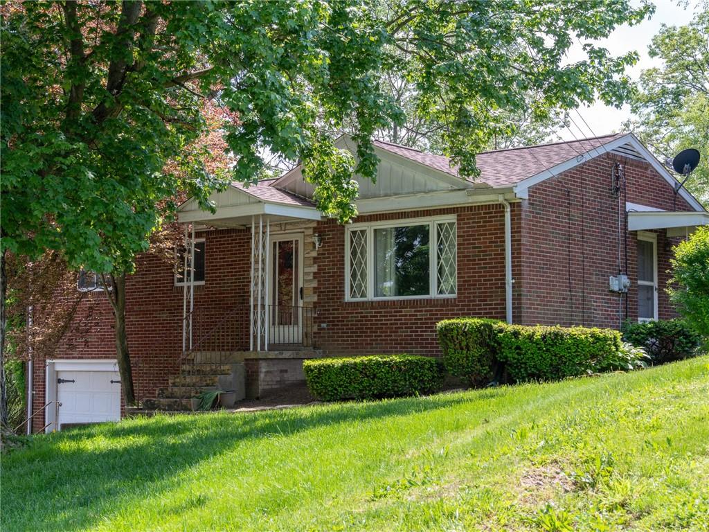 128 Clover Drive Monaca, PA 15061 - Photo 2 of 19 a view of a house with a yard and plants