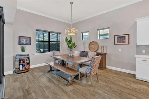 a bedroom with a bed couch and a window