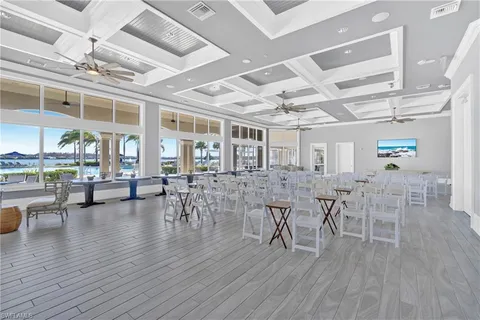 a view of a dining hall with lots of tables and chairs