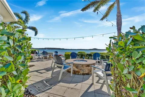 a house view with a sitting space and garden