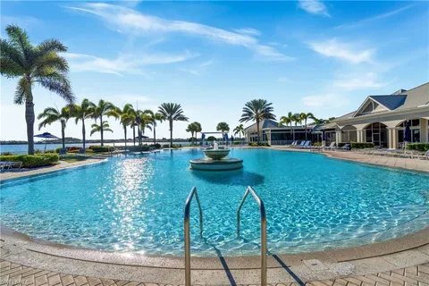 a view of swimming pool with seating area