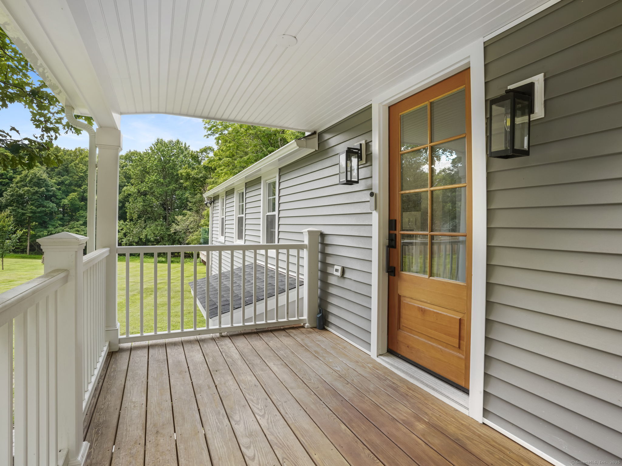 67 Hill Road Redding, CT 06896 - Photo 1 of 1 a view of balcony with wooden floor and fence