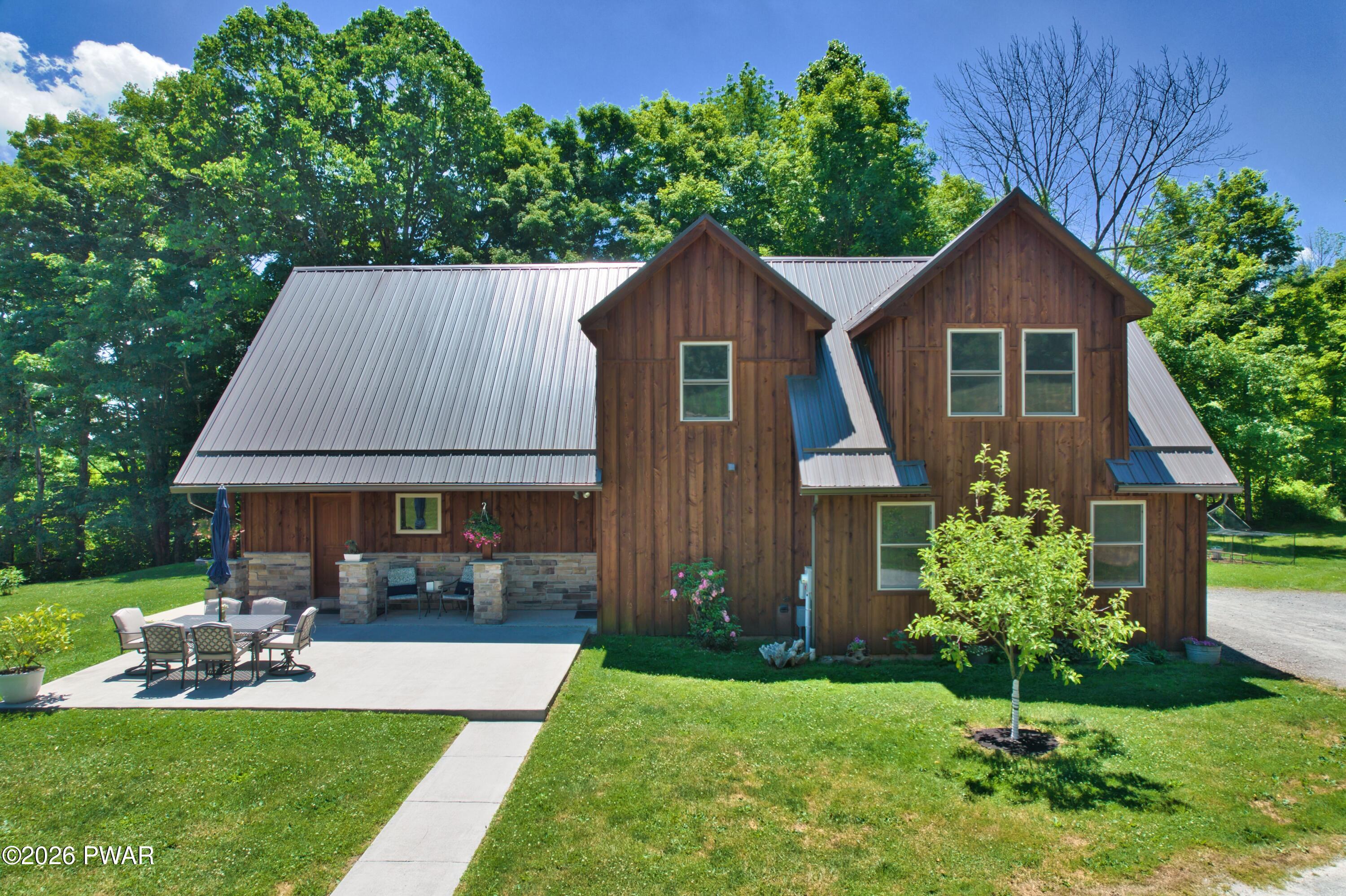 149 Sheards Road Milanville, PA 18443 - Photo 2 of 57 a front view of house with yard and green space