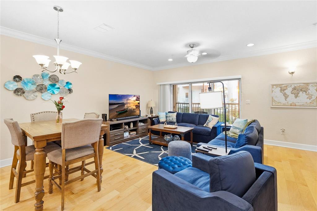 150 164th Avenue Redington Beach, FL 33708 - Photo 12 of 64 a living room with furniture potted plant and a chandelier