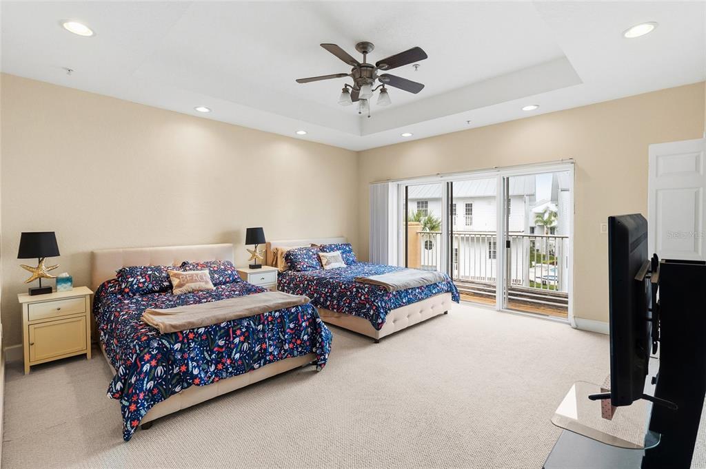 150 164th Avenue Redington Beach, FL 33708 - Photo 19 of 64 a bedroom with bed and glass door