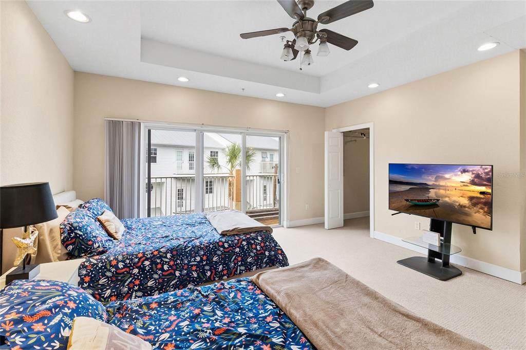 150 164th Avenue Redington Beach, FL 33708 - Photo 20 of 64 a bedroom with a bed and a chandelier