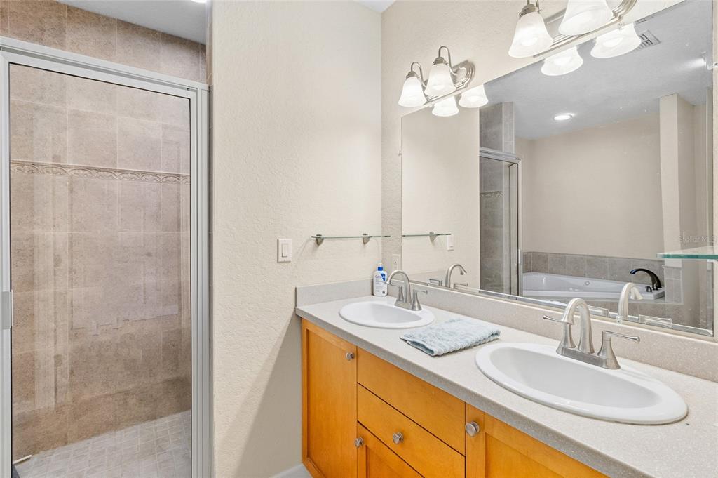 150 164th Avenue Redington Beach, FL 33708 - Photo 22 of 64 a bathroom with a sink double vanity and a mirror