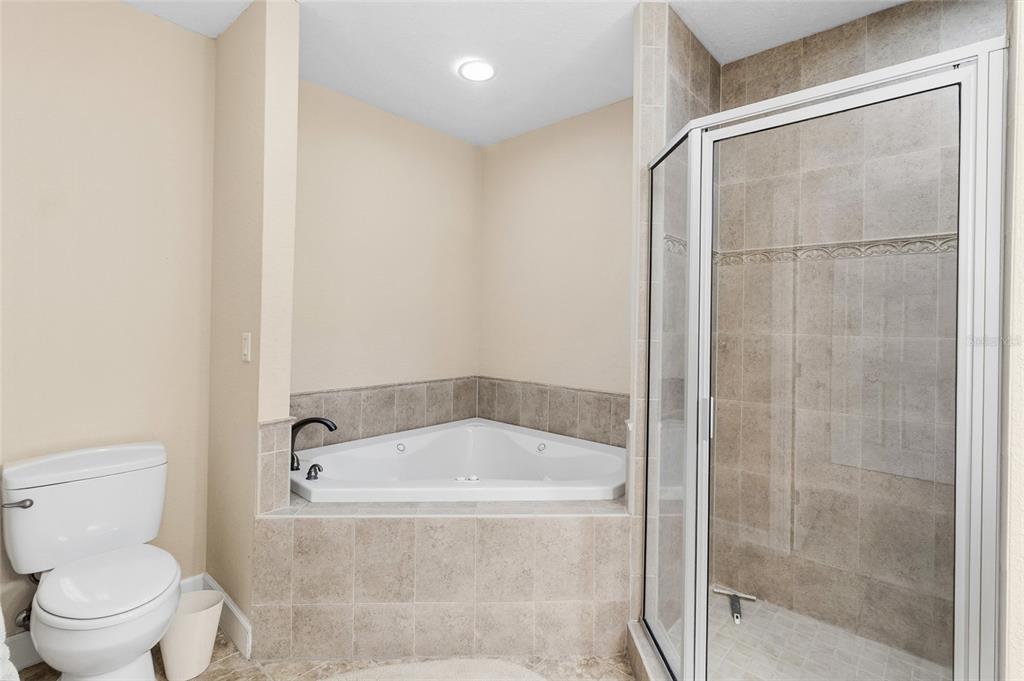 150 164th Avenue Redington Beach, FL 33708 - Photo 23 of 64 a white bath tub sitting next to a toilet