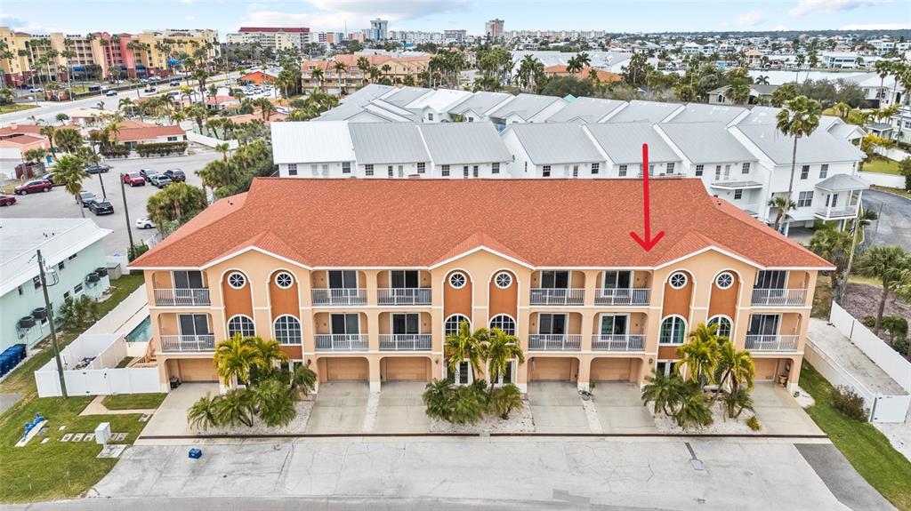 150 164th Avenue Redington Beach, FL 33708 - Photo 3 of 64 an aerial view of residential houses with cars parked in front of house