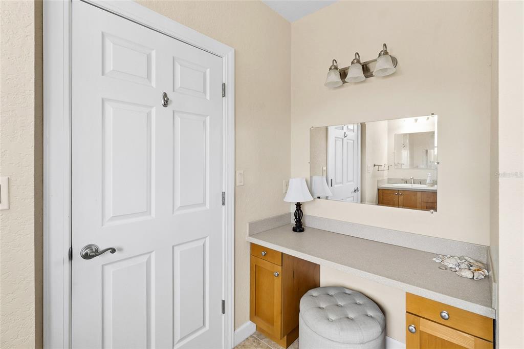 150 164th Avenue Redington Beach, FL 33708 - Photo 32 of 64 a bathroom with a sink a toilet and a mirror