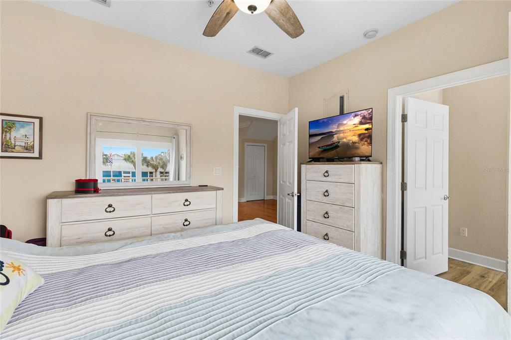 150 164th Avenue Redington Beach, FL 33708 - Photo 36 of 64 a bedroom with a bed and a flat screen tv