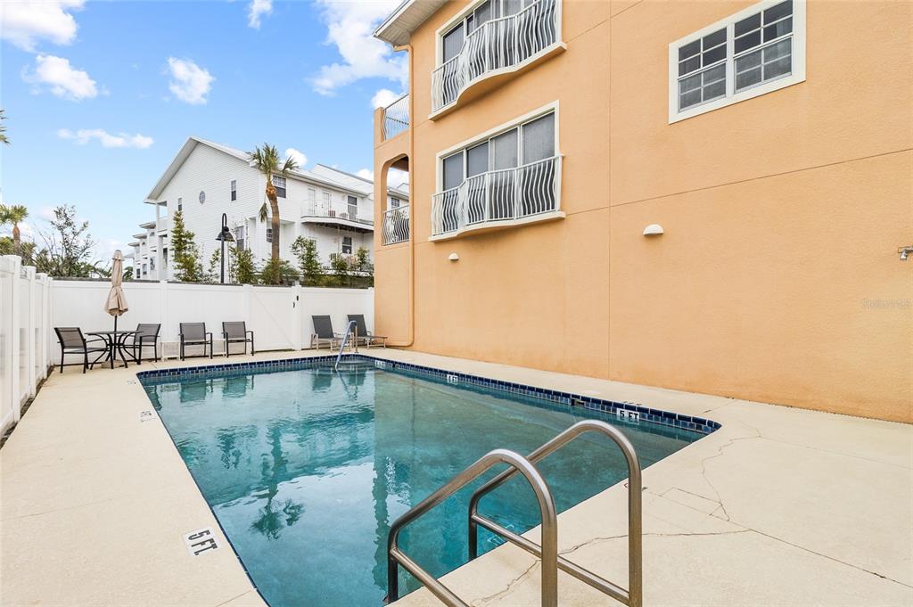 150 164th Avenue Redington Beach, FL 33708 - Photo 47 of 64 a view of a swimming pool with a lounge chairs