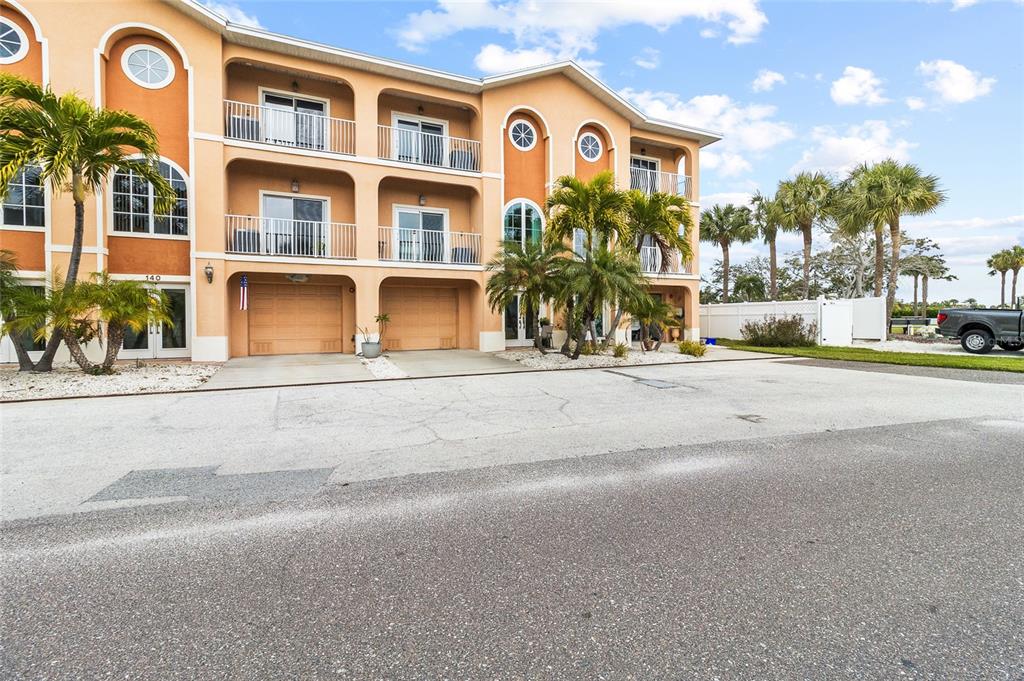 150 164th Avenue Redington Beach, FL 33708 - Photo 48 of 64 a front view of residential houses with street