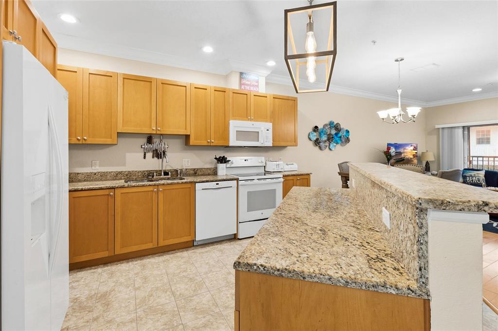 150 164th Avenue Redington Beach, FL 33708 - Photo 7 of 64 a kitchen with a sink a stove and cabinets