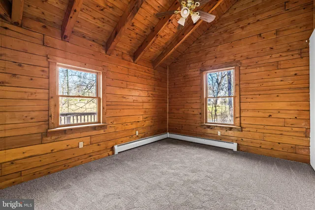 a view of a livingroom with an empty space and window