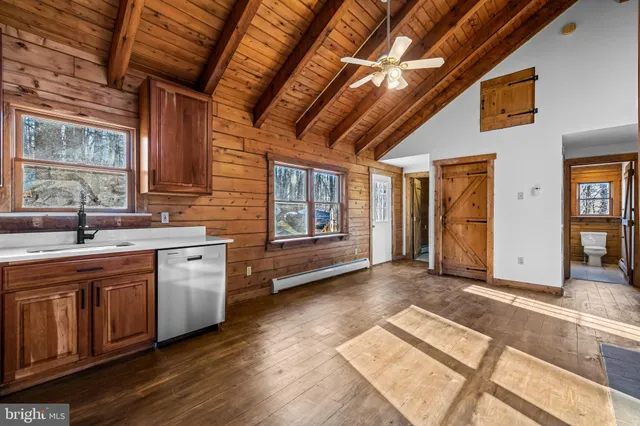 a view of a kitchen with a sink and cabinets