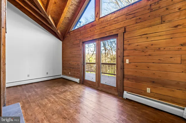 a view of an empty room and a window
