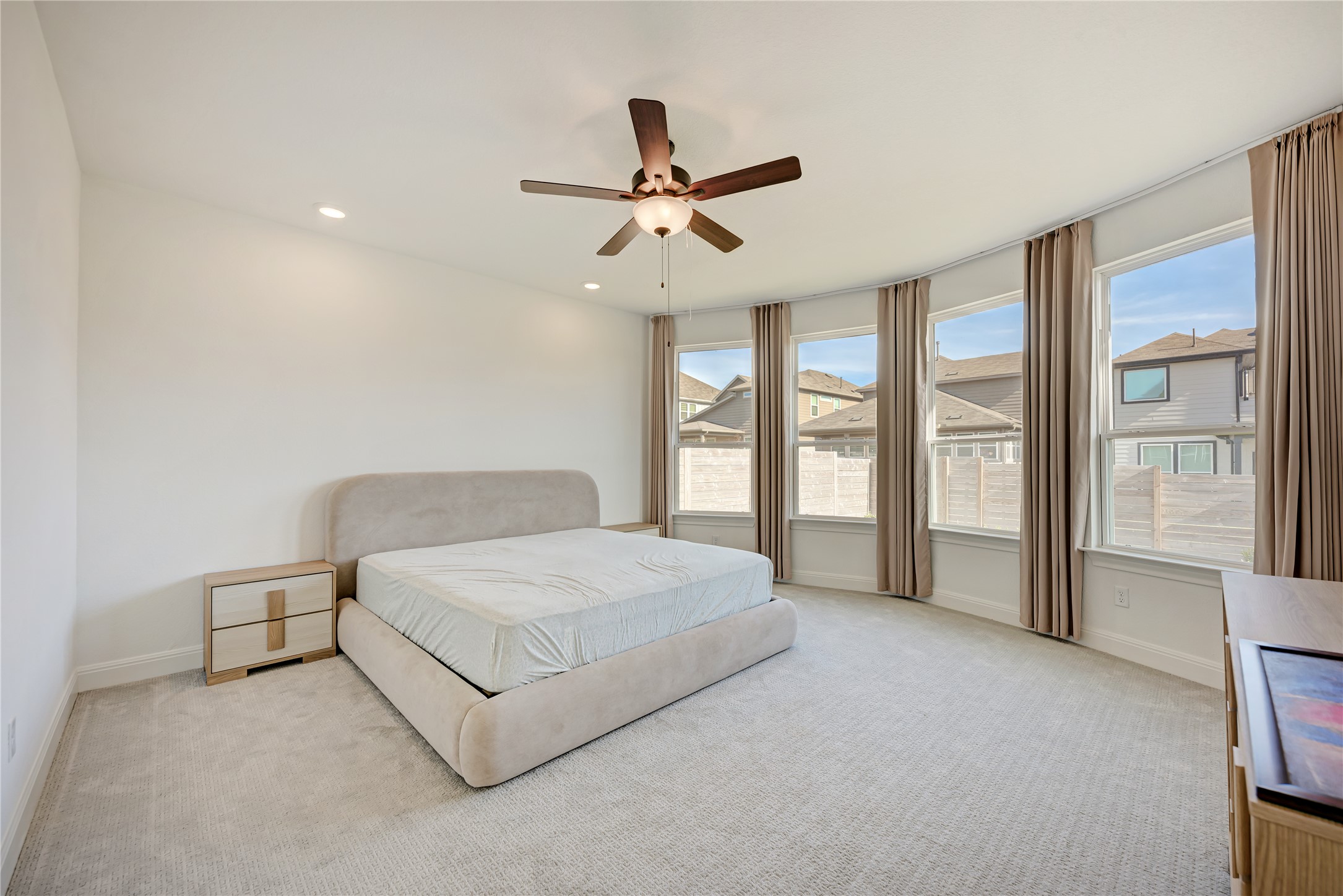 316 Regatta Trail Leander, TX 78641 - Photo 17 of 39 Spacious room featuring light-toned carpet, a ceiling fan with integrated lighting, and recessed ceiling lights