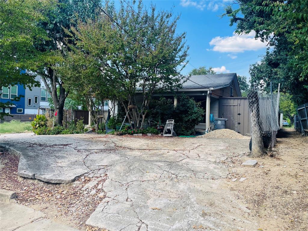 2247 Lovedale Avenue Dallas, TX 75235 - Photo 2 of 4 a view of a backyard with large trees