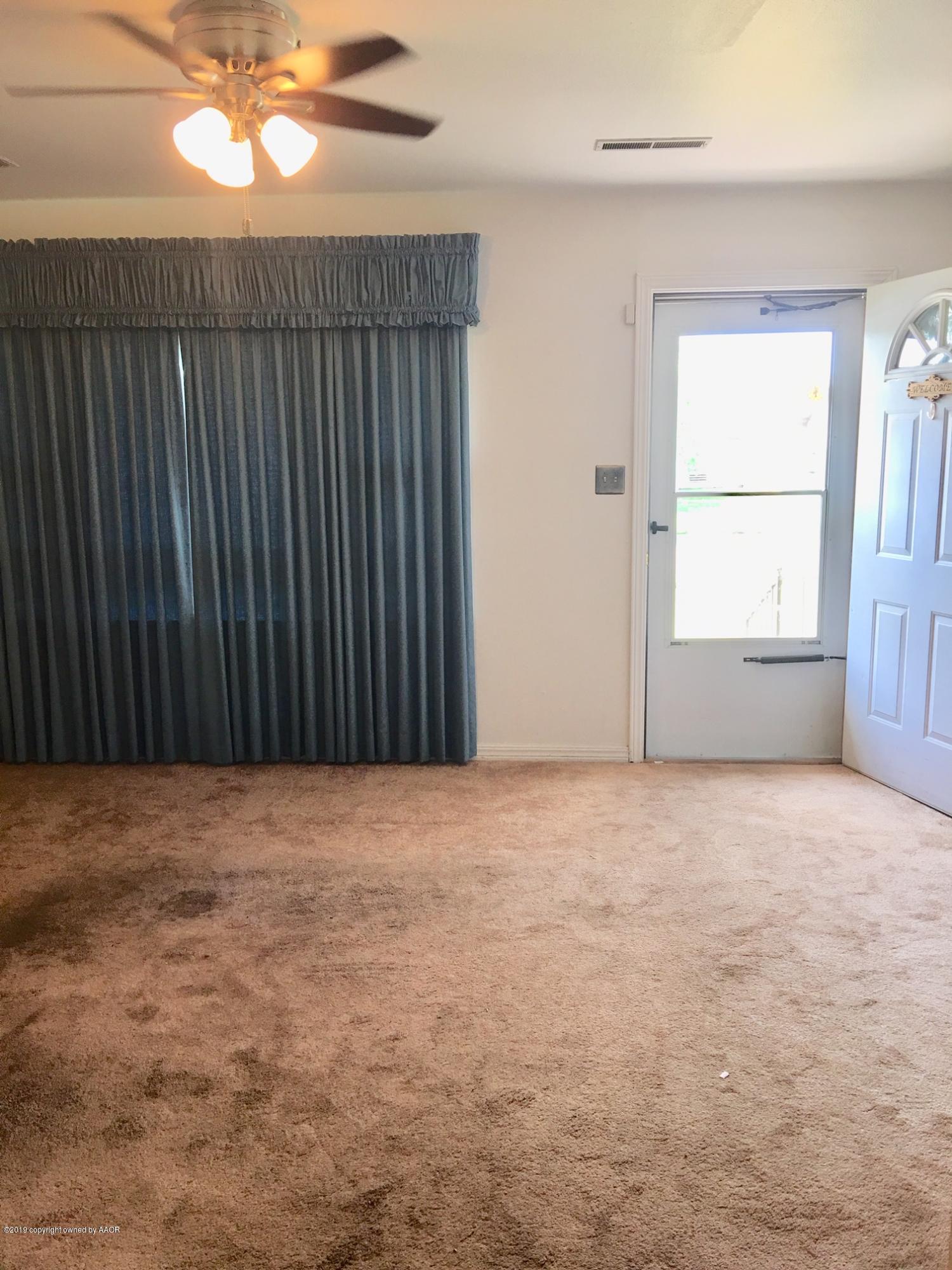 4123 South Crockett Street Amarillo, TX 79110 - Photo 3 of 23 a view of an empty room with a window