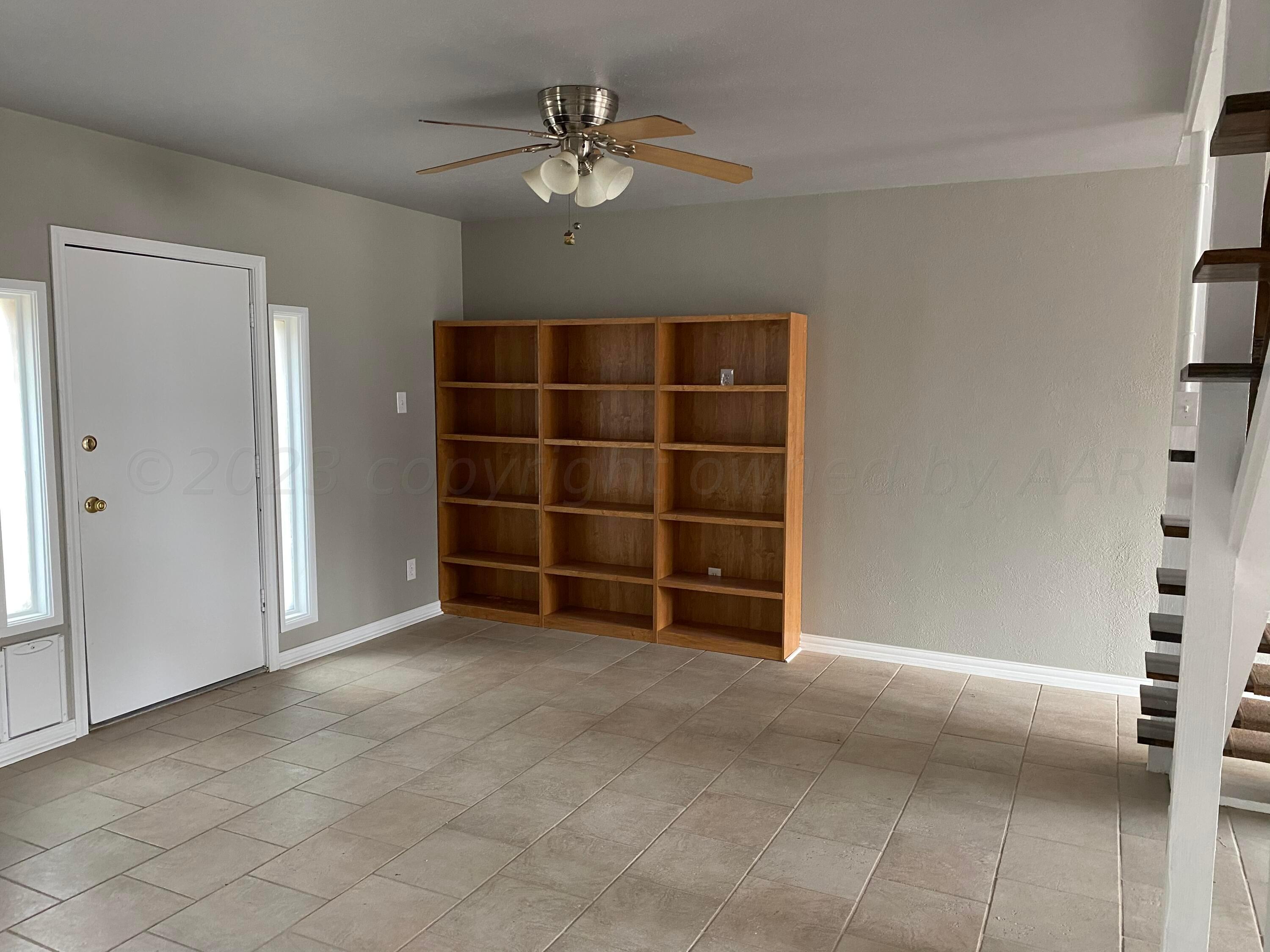 4700 Oregon Trail Amarillo, TX 79109 - Photo 3 of 9 an empty room with closet and ceiling fan