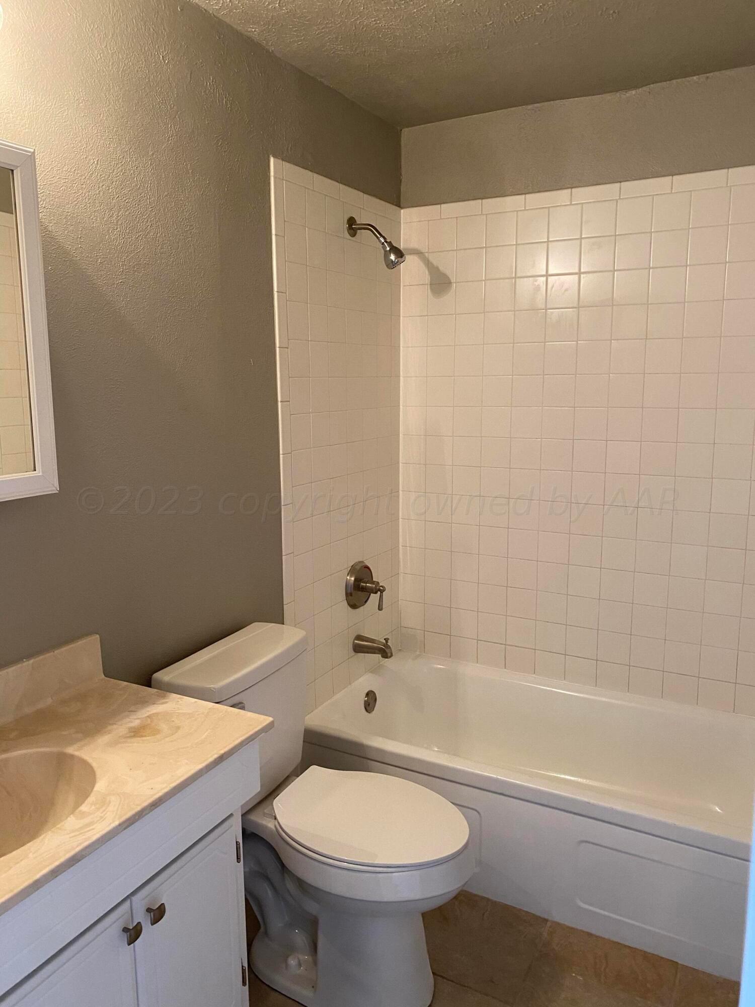 4700 Oregon Trail Amarillo, TX 79109 - Photo 6 of 9 a bathroom with a sink a toilet and shower