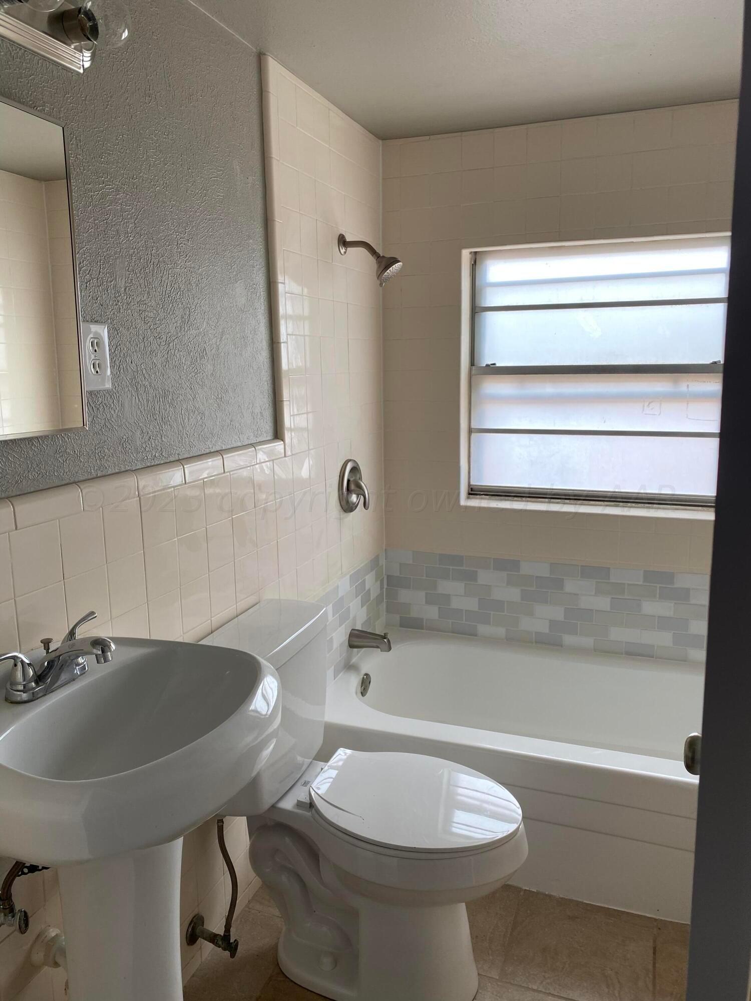4700 Oregon Trail Amarillo, TX 79109 - Photo 9 of 9 a bathroom with a sink and a toilet