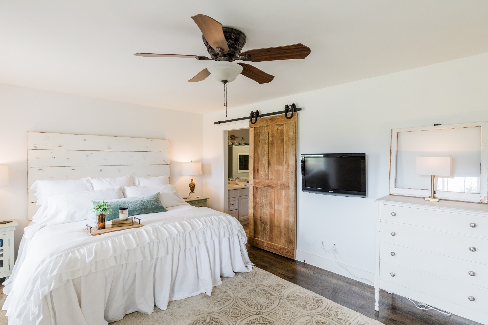 2071 Bradbury Road Adams, TN 37010 - Photo 22 of 47 a bedroom with a bed and a flat screen tv