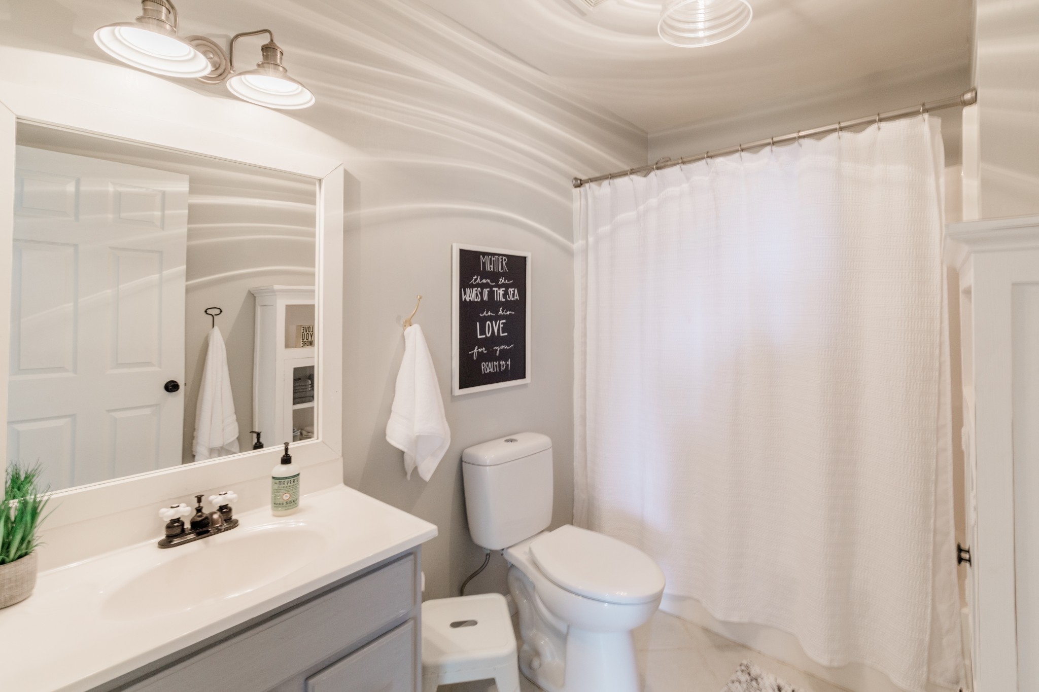 2071 Bradbury Road Adams, TN 37010 - Photo 34 of 47 a bathroom with a sink a toilet and shower curtain