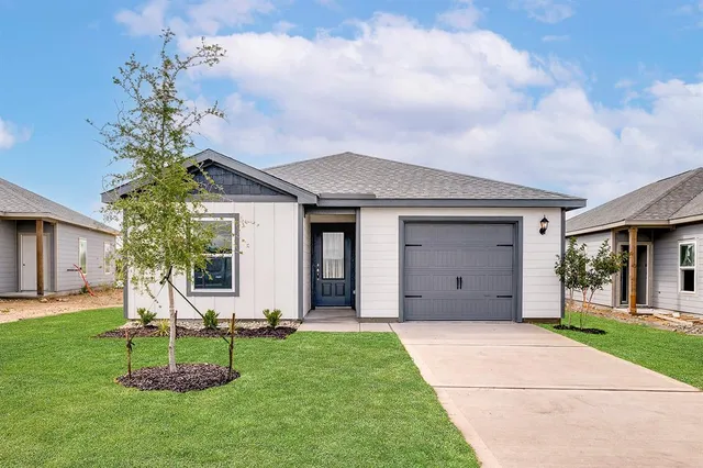 a house with garden in front of it