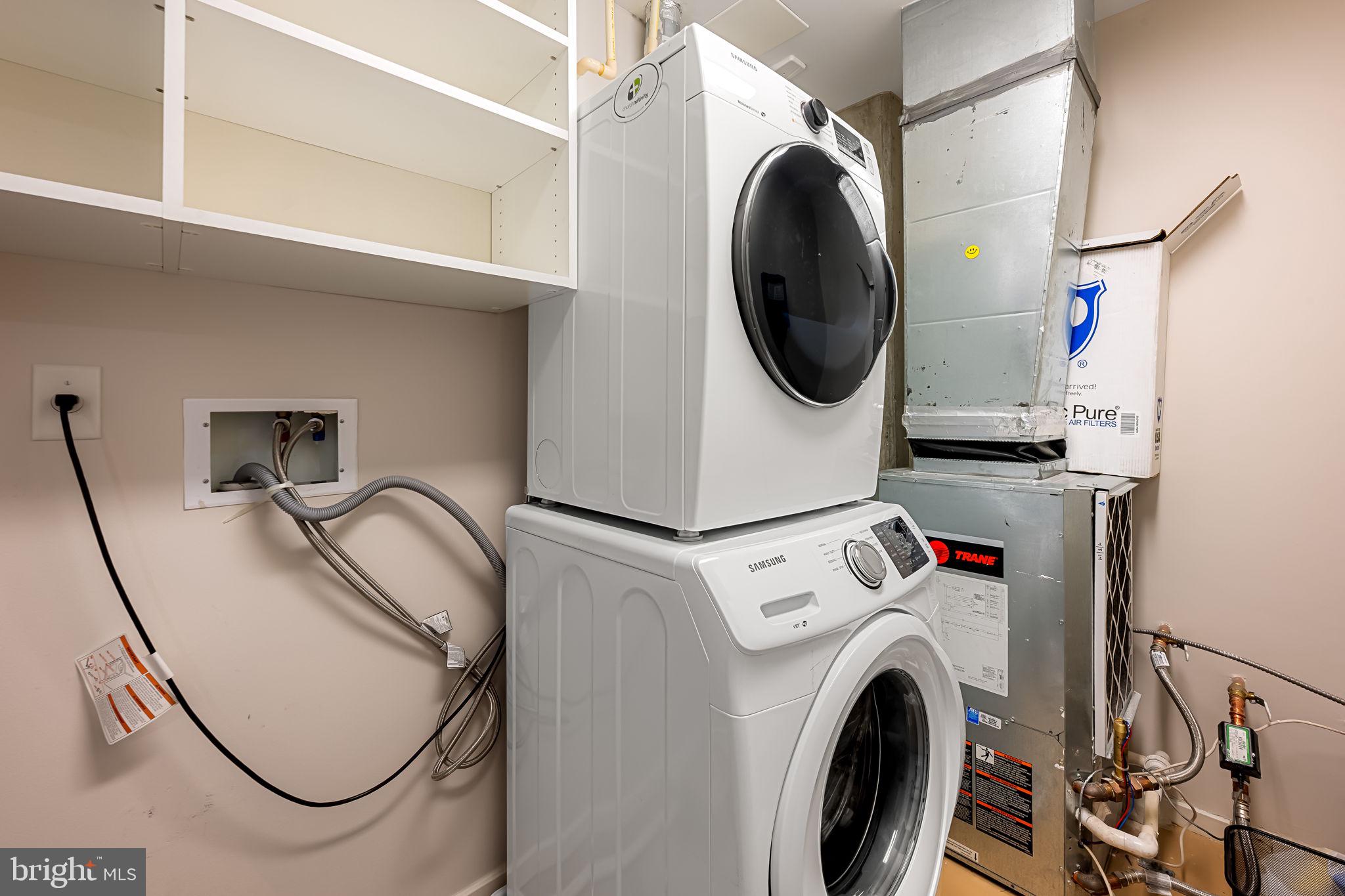 1200 Steuart Street, Unit 425 Baltimore, MD 21230 - Photo 18 of 33 a utility room with dryer and washer