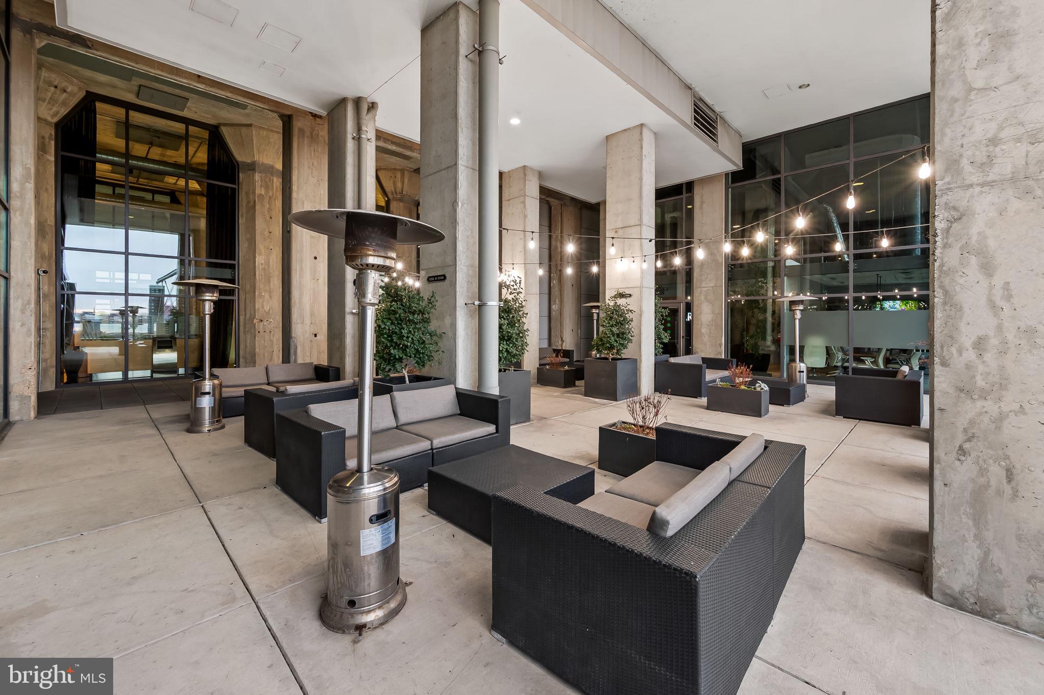 1200 Steuart Street, Unit 425 Baltimore, MD 21230 - Photo 25 of 33 a living room with fireplace furniture and a large window