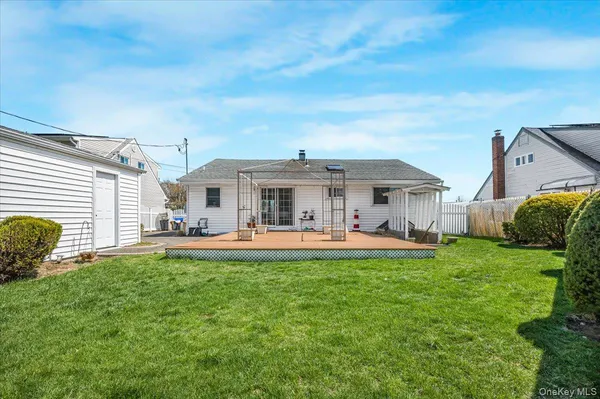 a front view of house with yard and outdoor seating