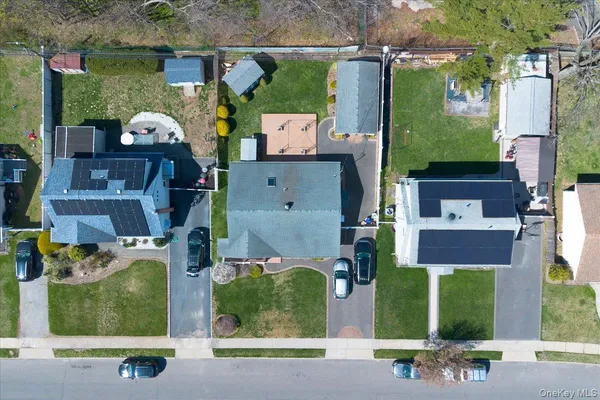 an aerial view of houses with yard