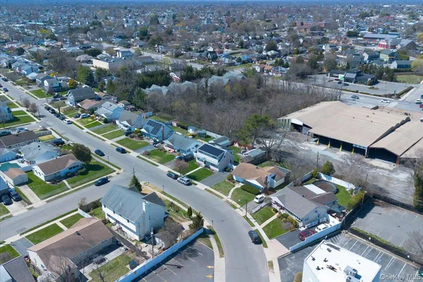an aerial view of a house with outdoor space