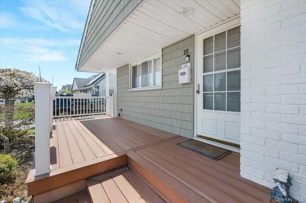 a view of balcony with wooden floor and floor to ceiling window
