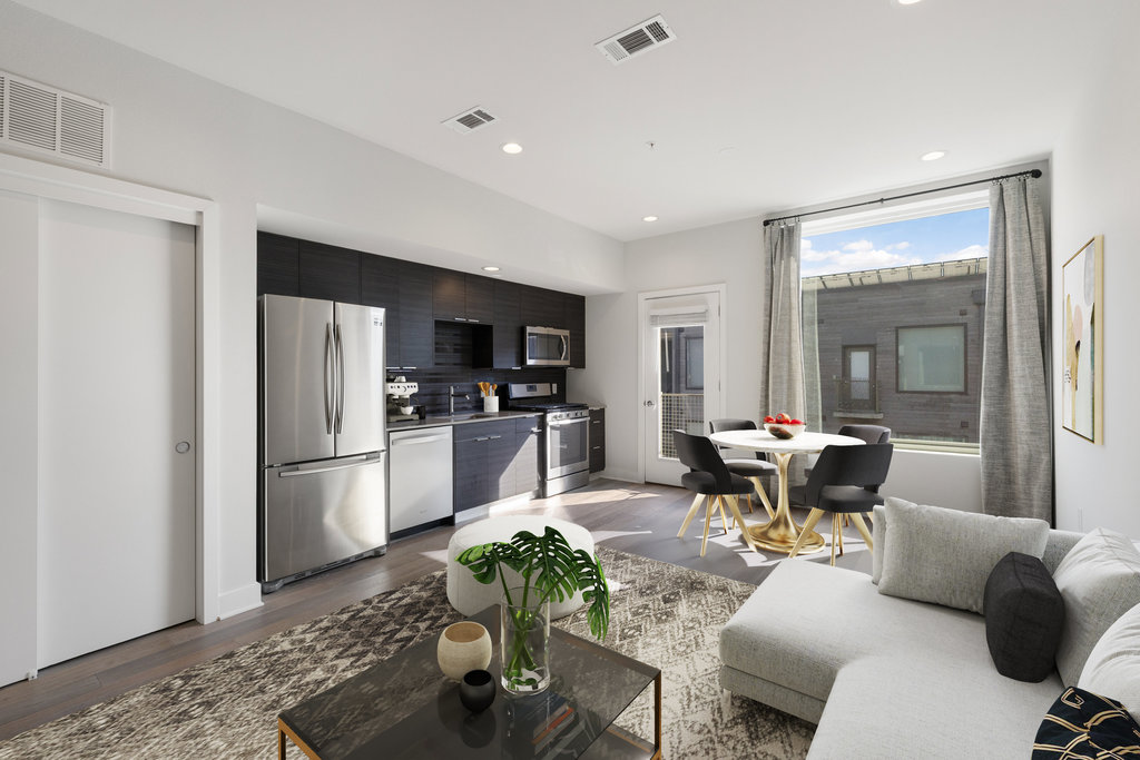 1800 East 4th Street, Unit 327 Austin, TX 78702 - Photo 1 of 20 a living room with furniture and kitchen view