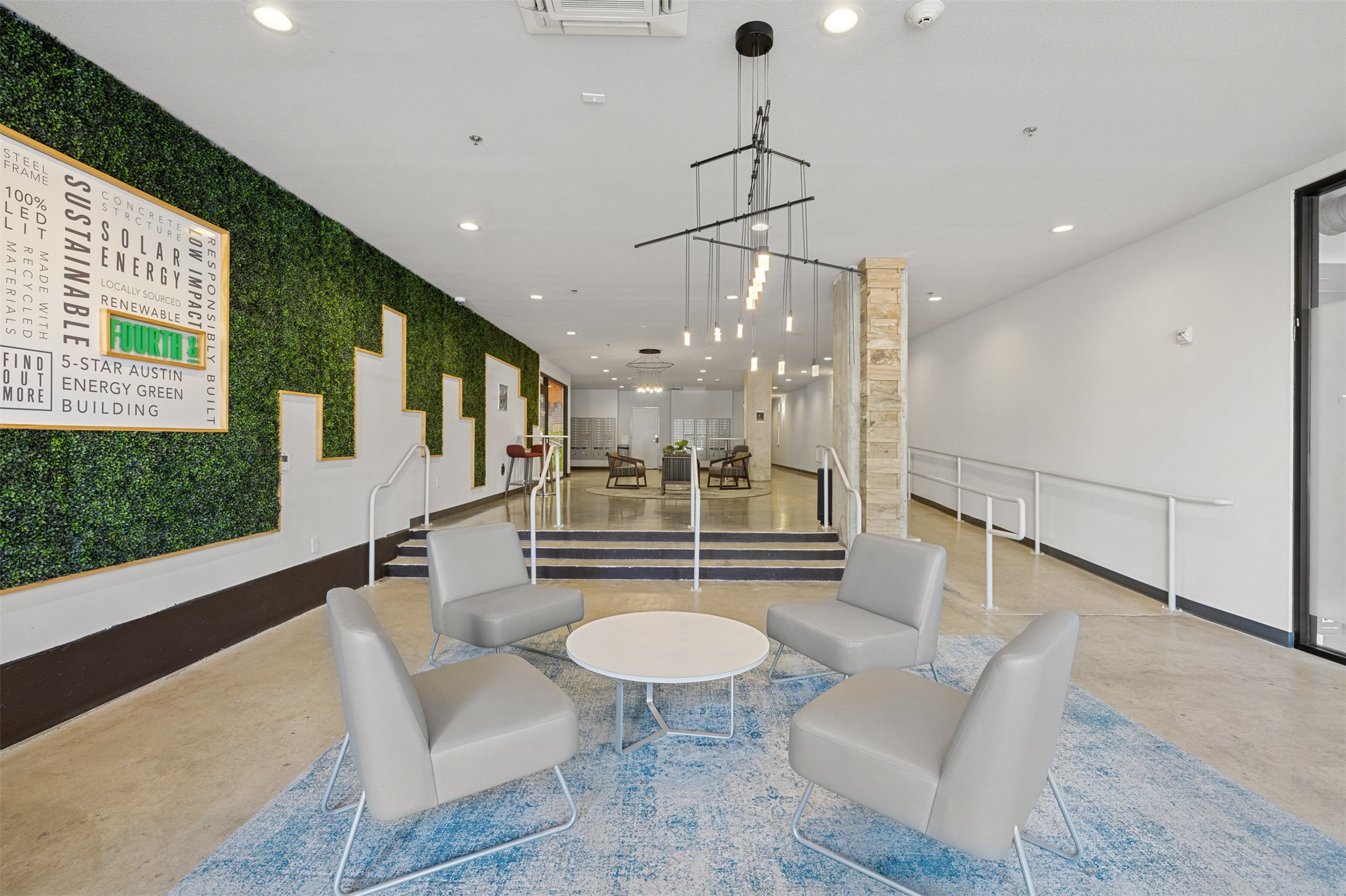 1800 East 4th Street, Unit 327 Austin, TX 78702 - Photo 11 of 20 a living room with furniture a table and kitchen view