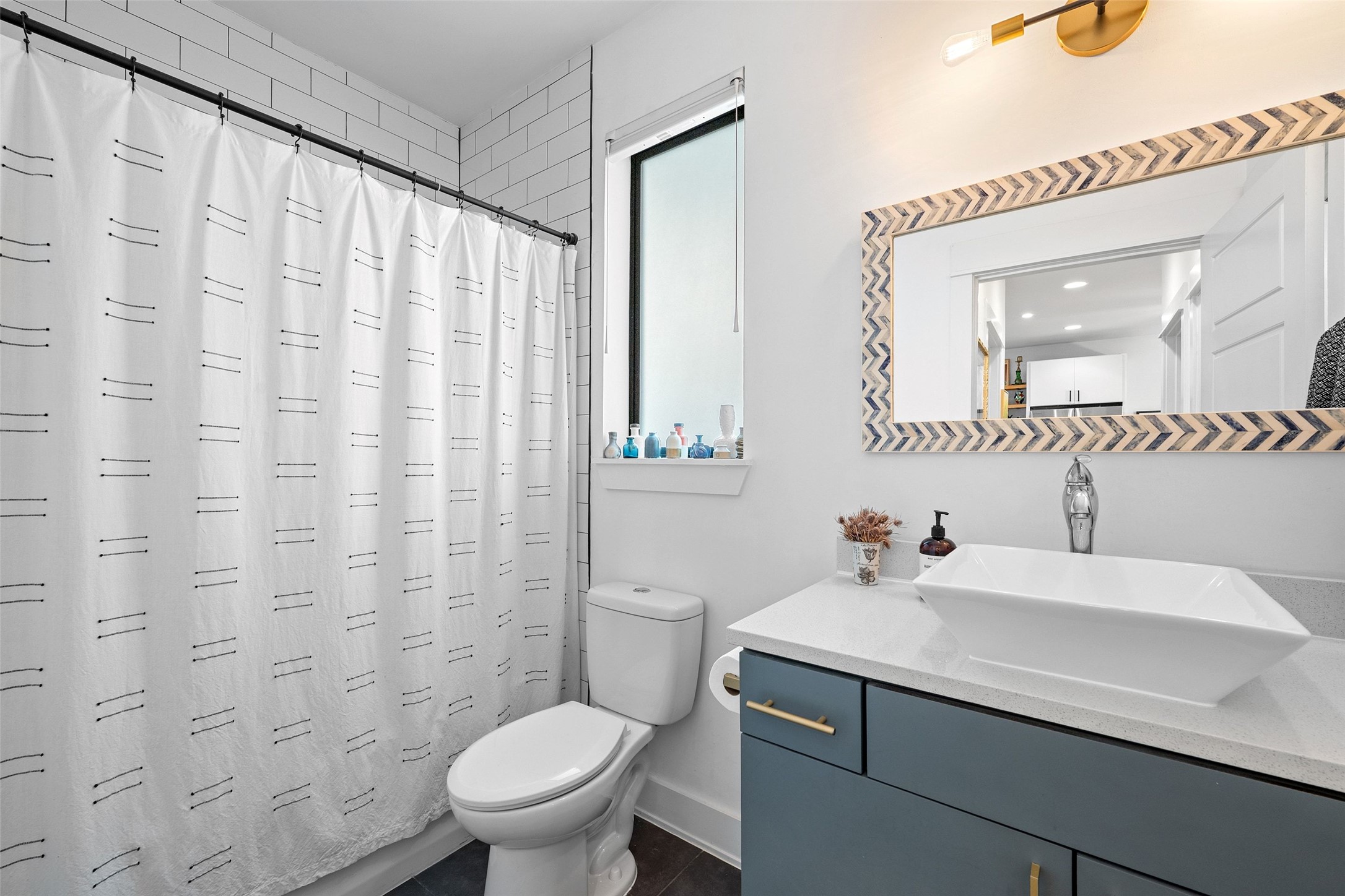 4615 Depew Avenue Austin, TX 78751 - Photo 27 of 40 Full bathroom downstairs attached to bedroom