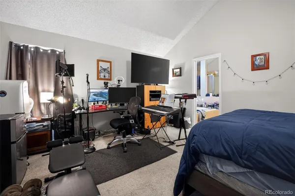 a bed room with a bed and a window