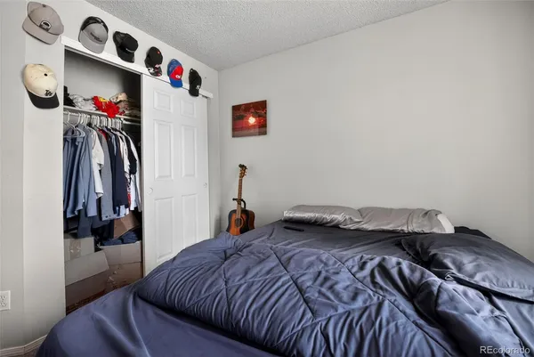 a bed room with a bed and a window