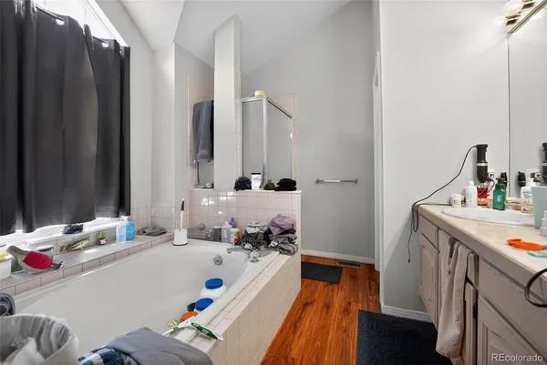 a bathroom with a sink mirror and toilet