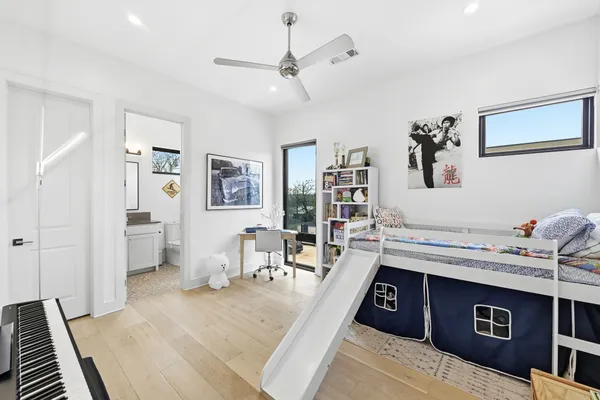 a bed room with a bed and a desk