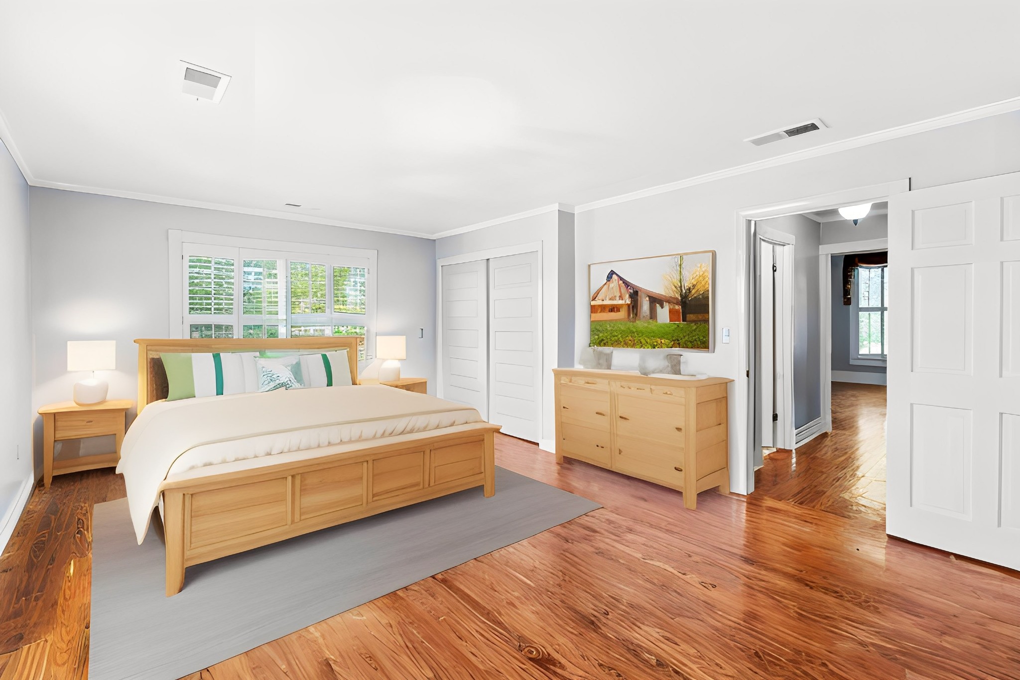10587 Fulton Road Ripley, TN 38063 - Photo 11 of 29 a spacious bedroom with a bed and a dresser with wooden floor