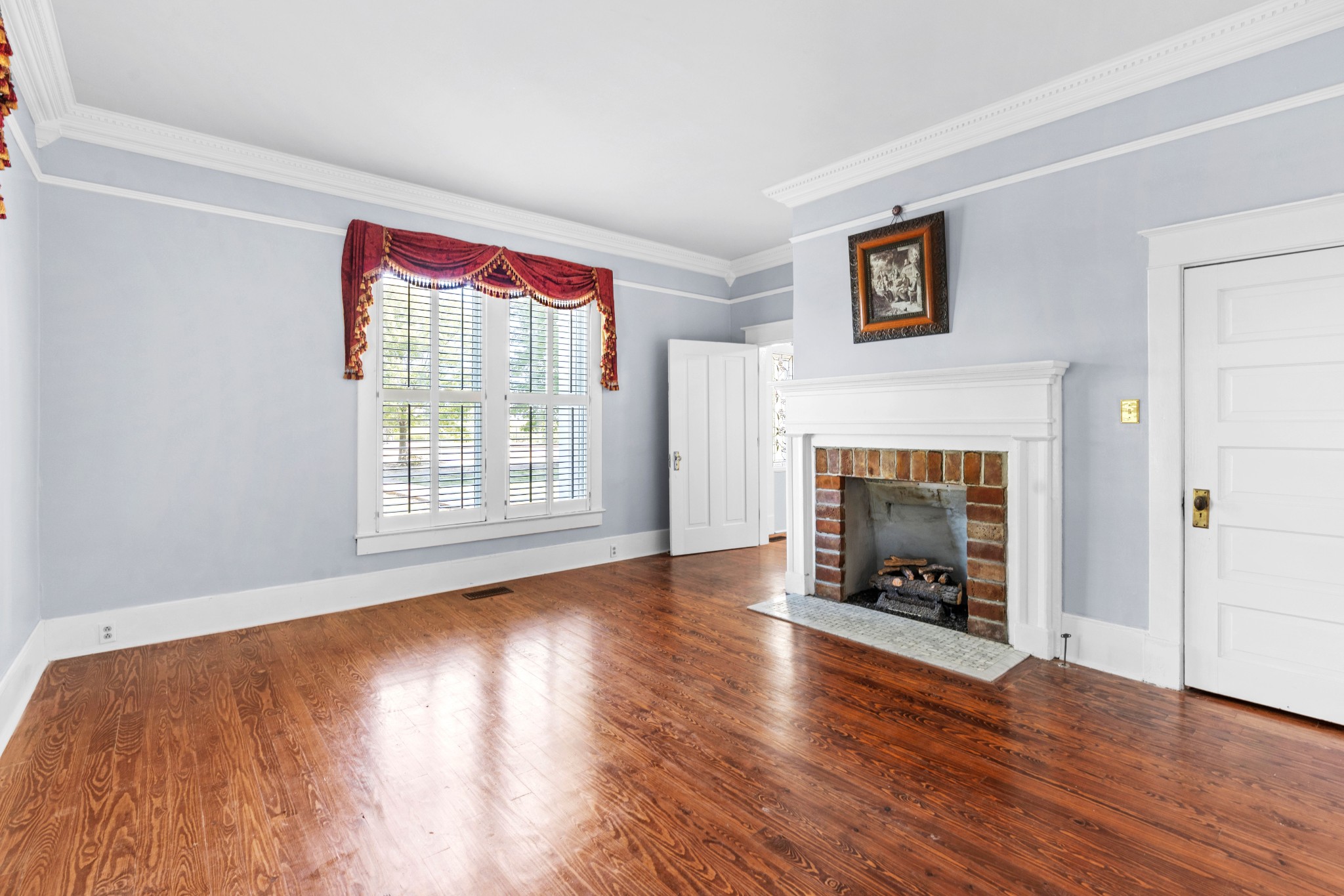 10587 Fulton Road Ripley, TN 38063 - Photo 13 of 29 a view of an empty room with window and fire place