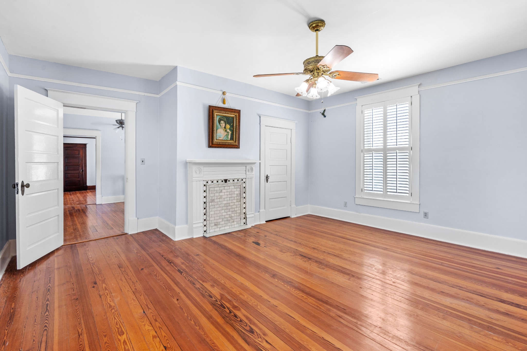 10587 Fulton Road Ripley, TN 38063 - Photo 21 of 29 a bedroom with a bed and a chandelier
