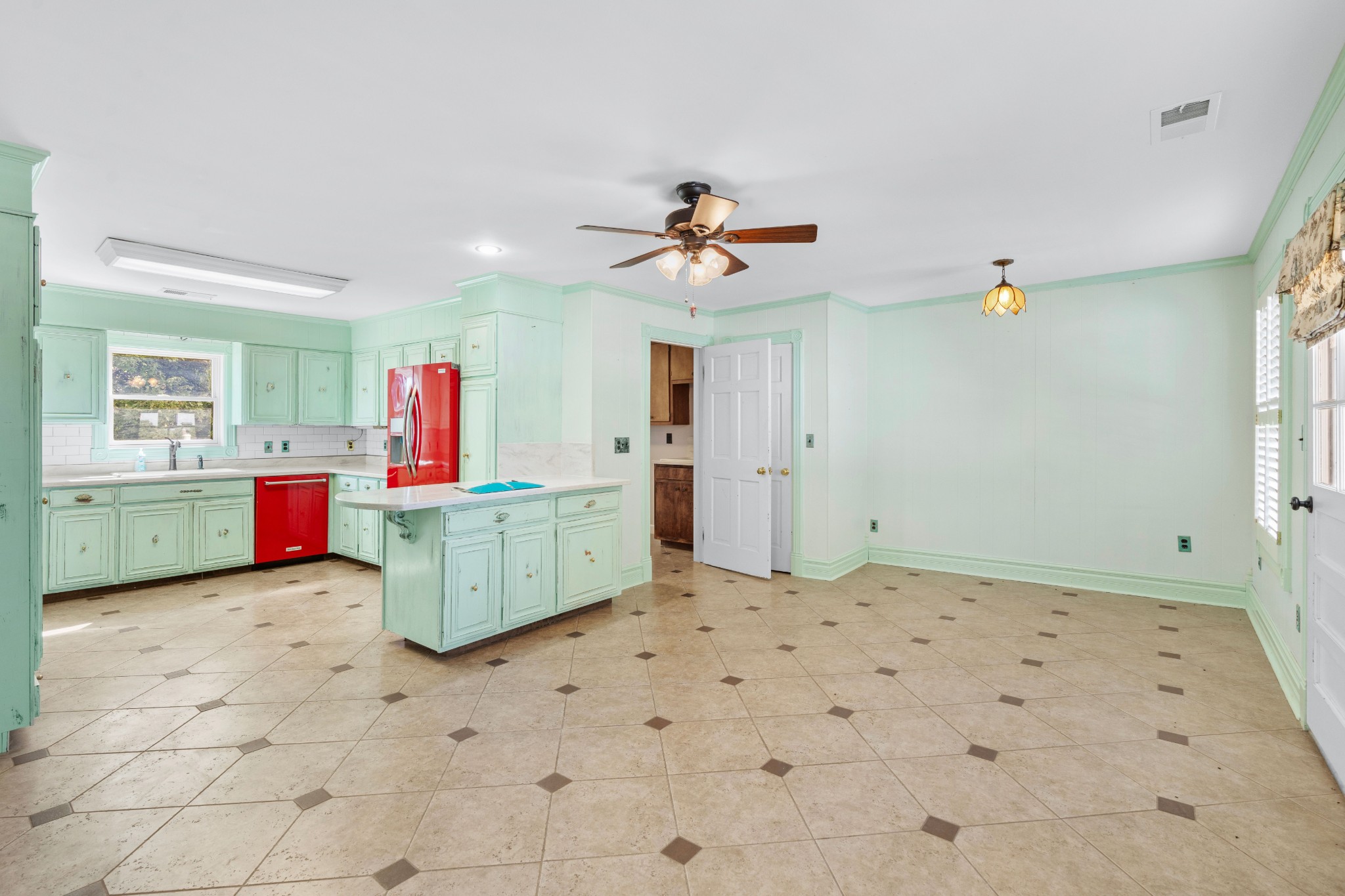 10587 Fulton Road Ripley, TN 38063 - Photo 28 of 29 a kitchen with granite countertop a stove a sink and a refrigerator