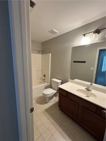 a bathroom with a double vanity sink mirror and double