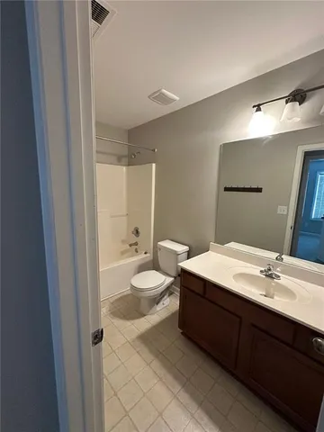 a bathroom with a double vanity sink mirror and double